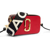 Red and black handbag with a visible brand logo on a white background
